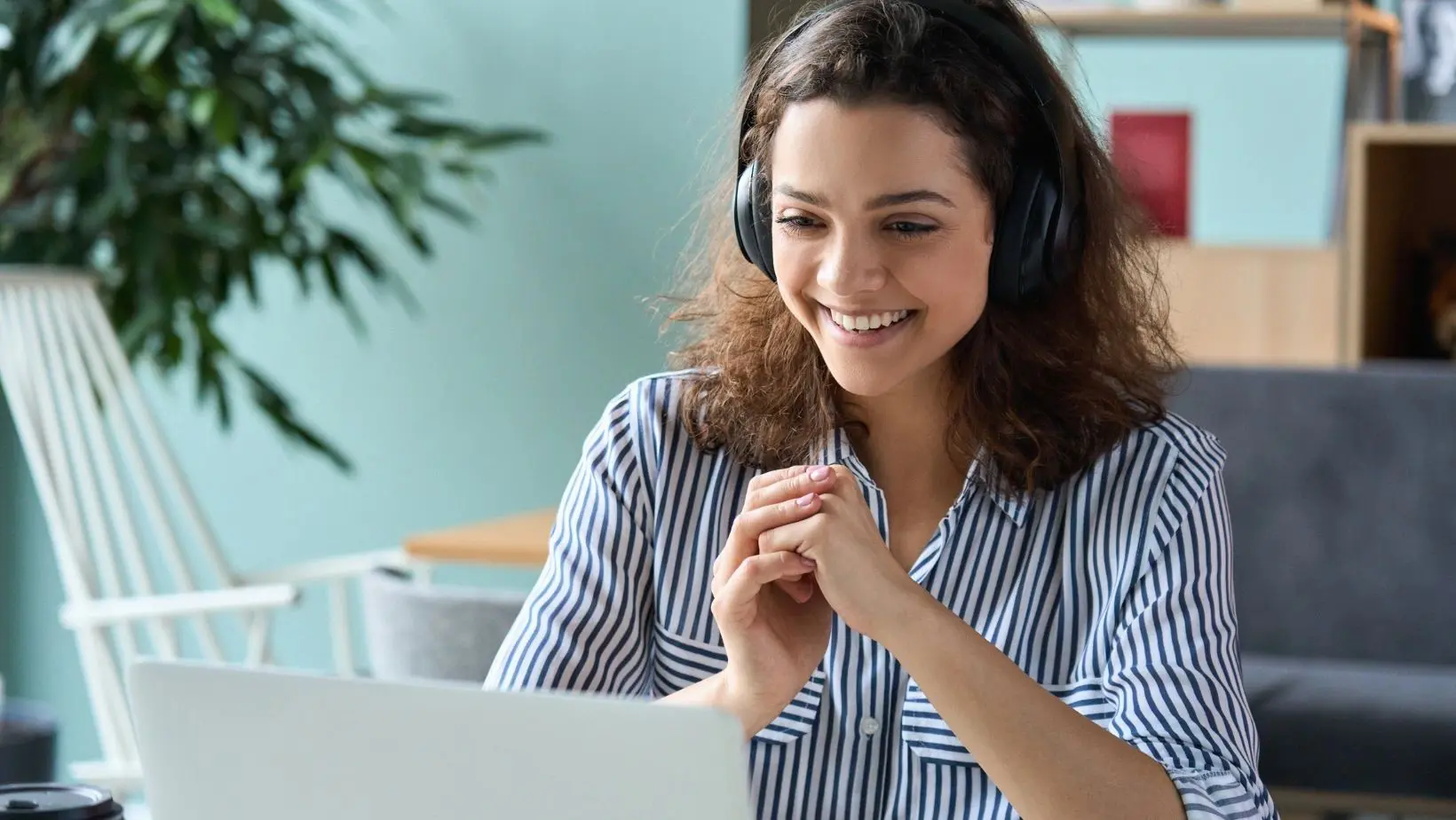 Female office worker at her computer smiling